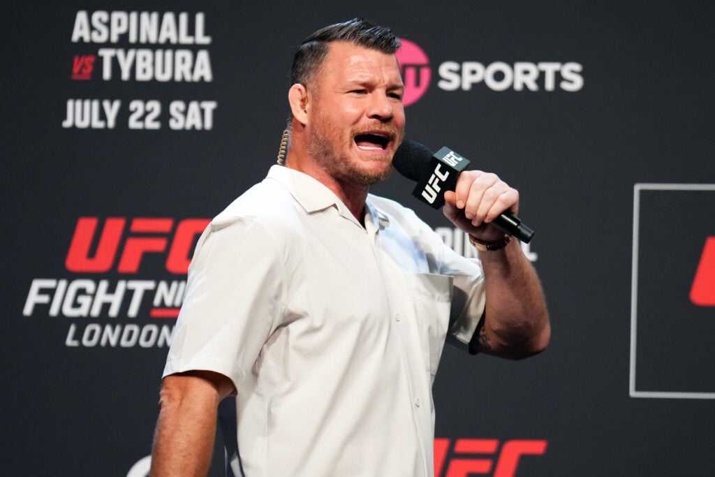 Michel Bisping speaks at the UFC London weigh-in in July 2023