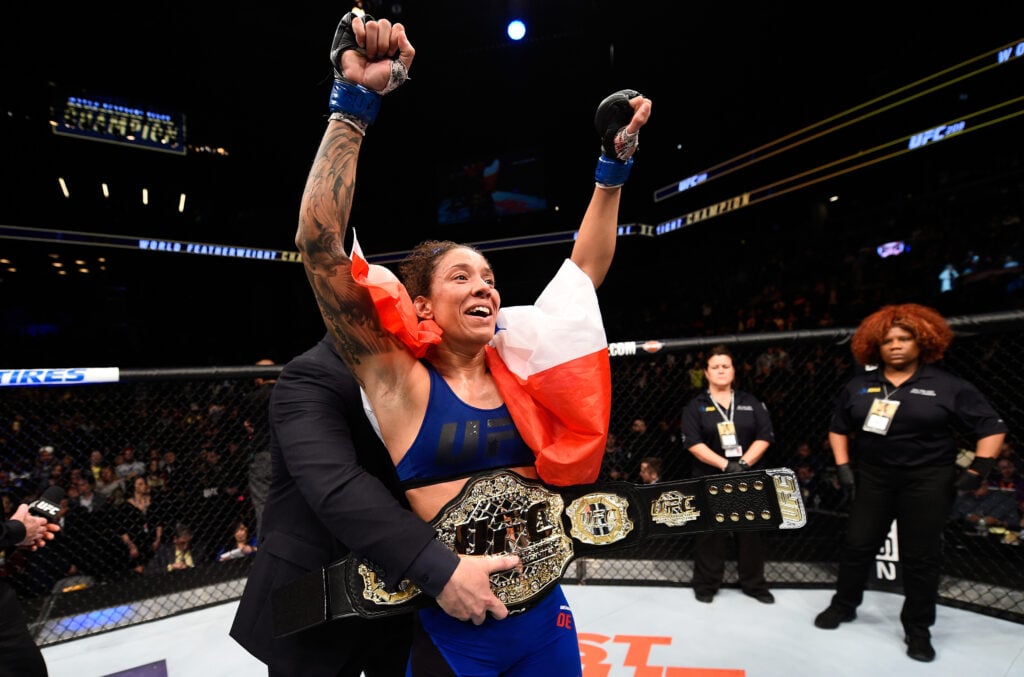 Germaine de Randamie celebrates after beating Holly Holm at UFC 208