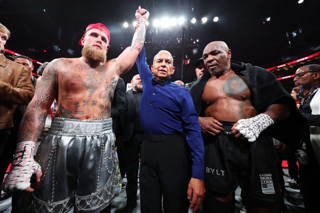 Jake Paul having his hand raised after beating Mike Tyson