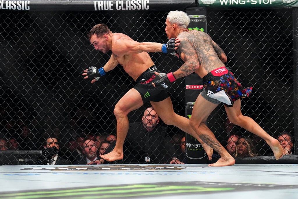 Charles Oliveira chases Michael Chandler during UFC 309 fight