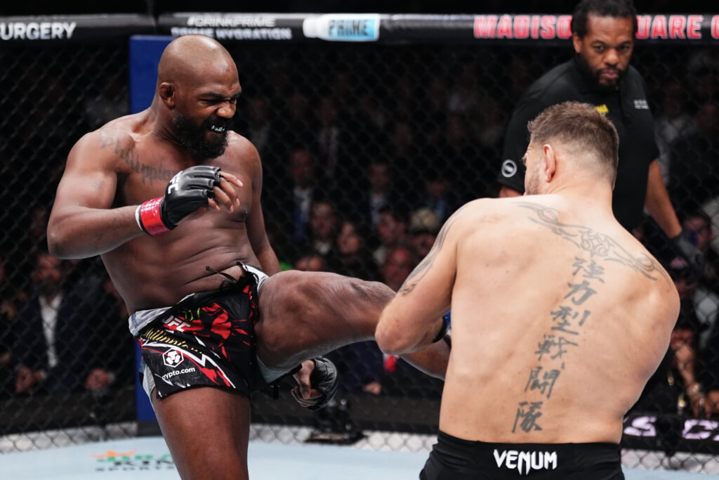 Jon Jones kicks Stipe Miocic during UFC 309