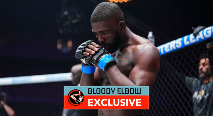 Impa Kasanaganay praying during a PFL fight. Overlay text reads: "BLOODY ELBOW EXCLUSIVE"