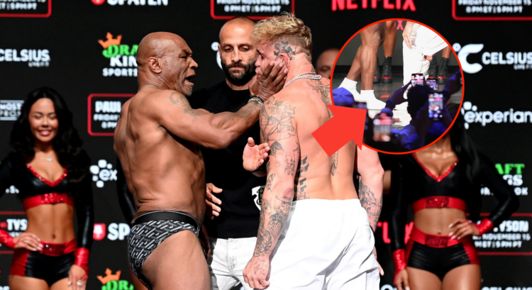 Main photo shows Mike Tyson slapping Jake Paul. Bubble, with arrow pointing towards it, appears to show Paul stepping on Tyson's toe