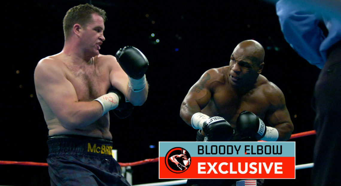 Photo shows Kevin McBride and Mike Tyson punching each other. Overlay text reads: "BLOODY ELBOW EXCLUSIVE"