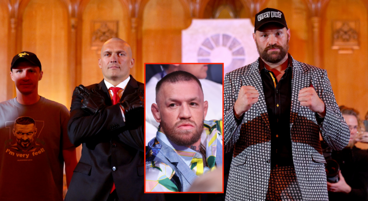 Tyson Fury (right) and Oleksandr Usyk (left) pose for photos following their press conference and Conor McGregor (middle)