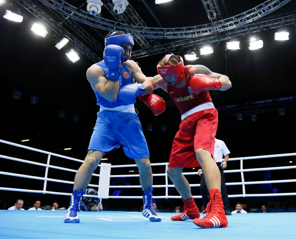 Oleksandr Usyk (R) of the Ukraine defend