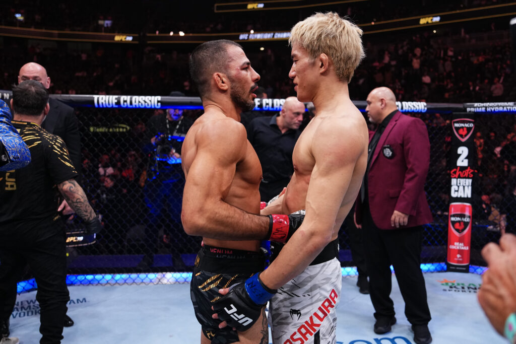 Alexandre Pantoja speaks to Kai Asakura after beating him at UFC 310