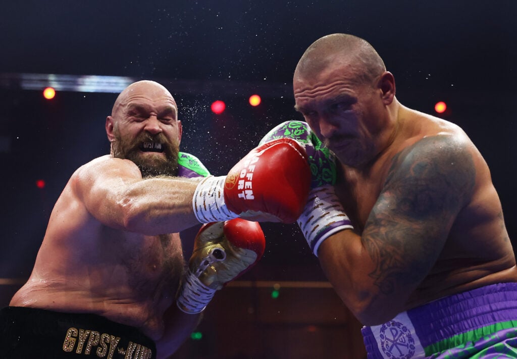 Tyson Fury punches Oleksandr Usyk