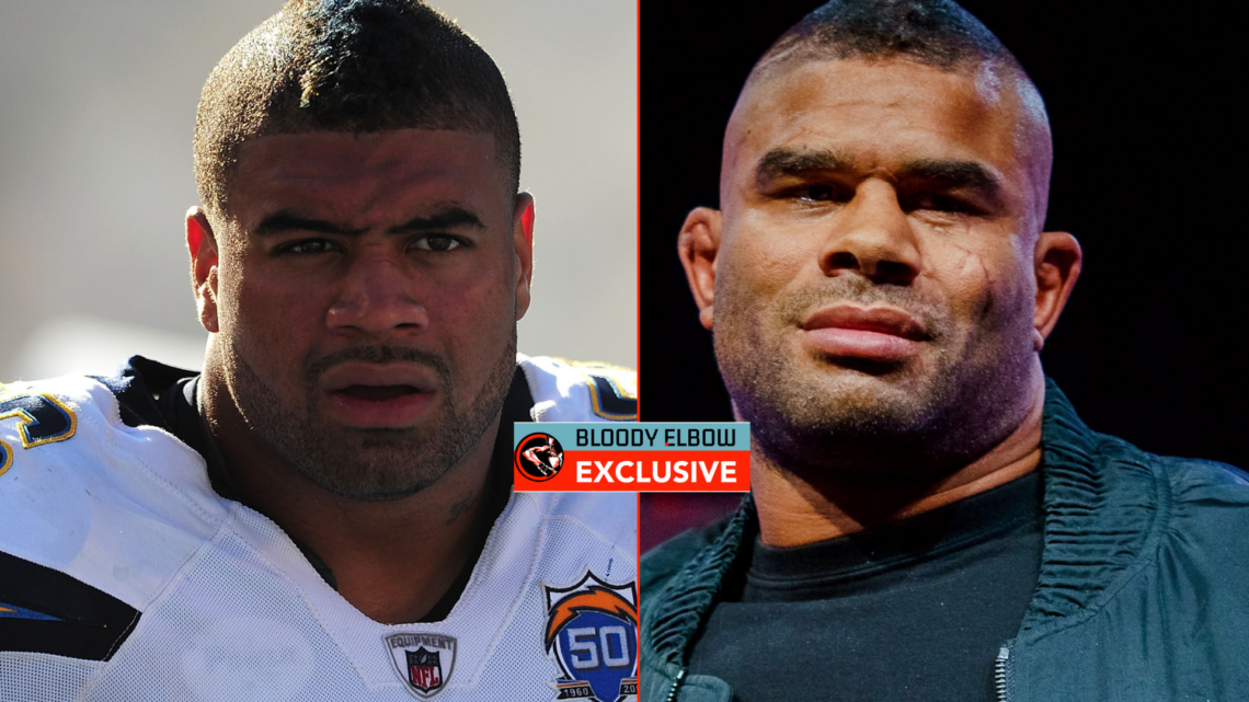 Shawne Merriman and Alistair Overeem with exclusive banner