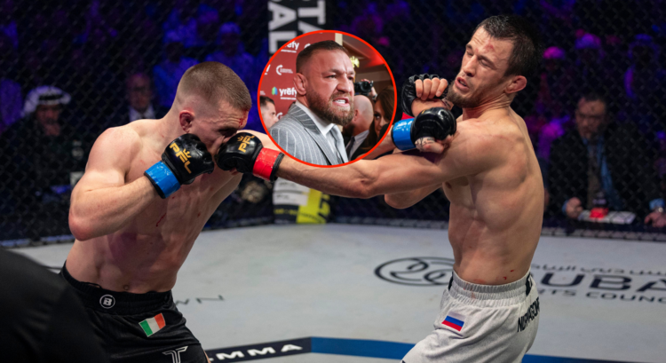 Paul Hughes punches Usman Nurmagomedov with Conor McGregor speaking angrily in a bubble