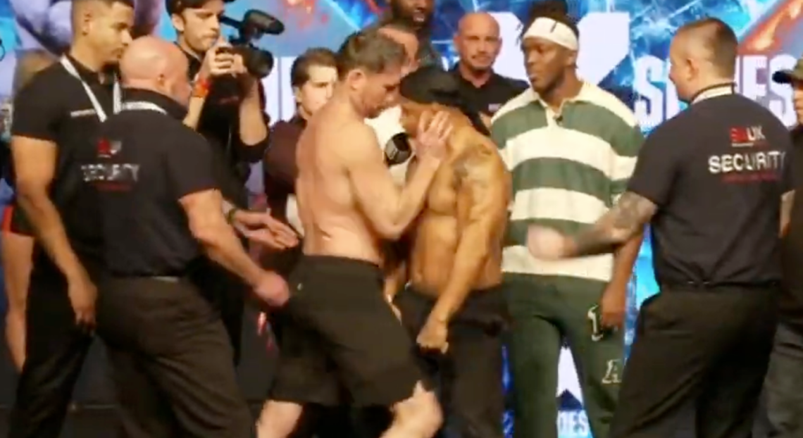 Darren Till pushes Anthony Taylor while KSI looks on and security step in