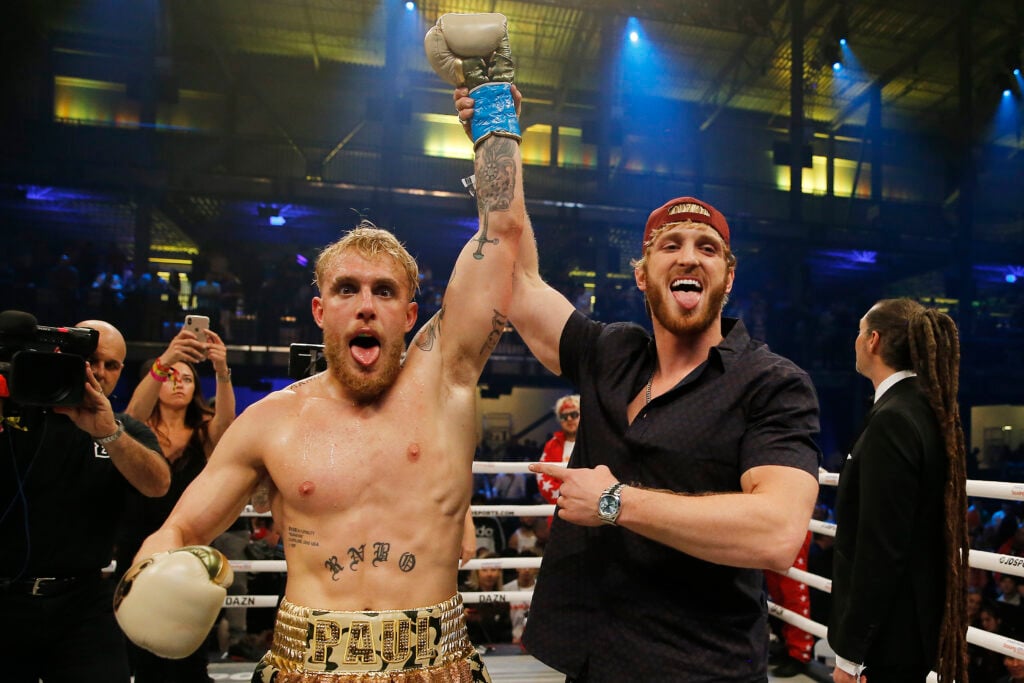 Jake Paul celebrates with his brother, Logan, after defeating AnEsonGib