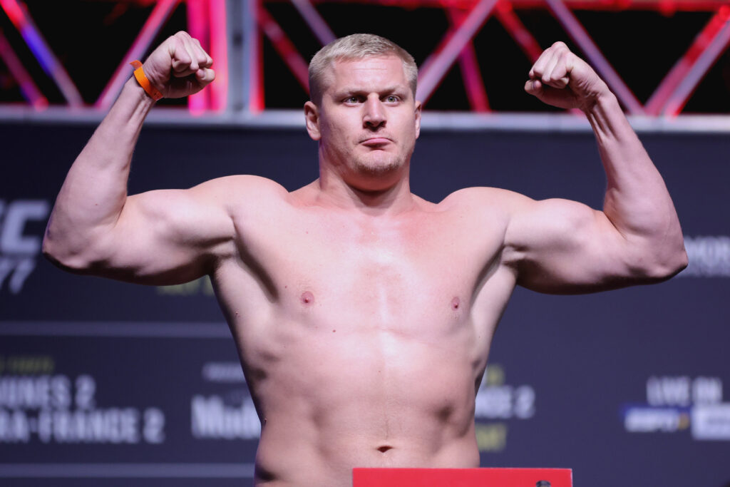 Sergei Pavlovich of Russia poses on the scale during the UFC 277 ceremonial weigh-in