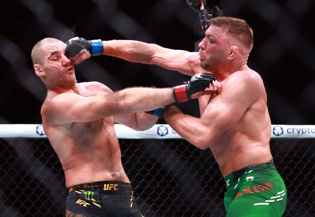 Dricus Du Plessis and Sean Strickland punch each other
