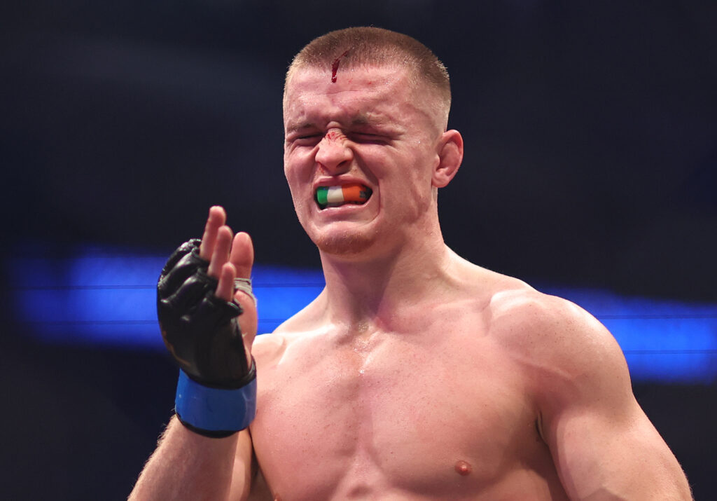 Paul Hughes reacts in between rounds during his fight with Usman Nurmagomedov