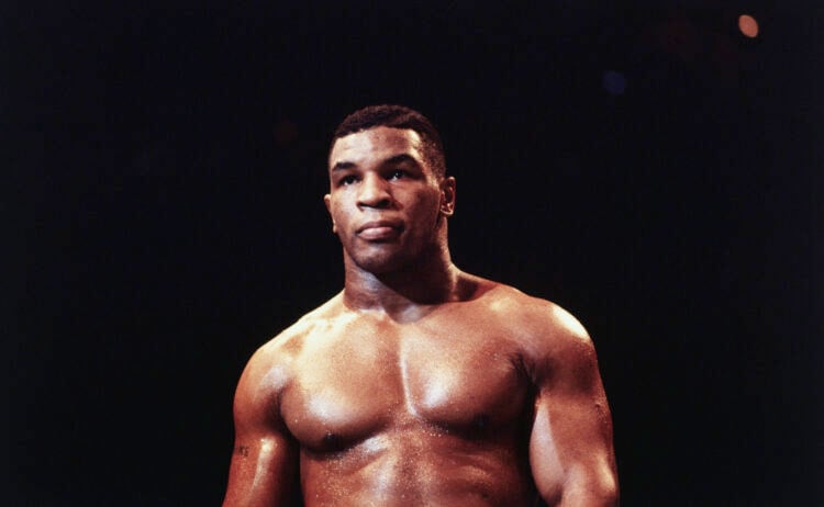 (Original Caption) Uniondale, New York: Mike Tyson, a heavyweight contender, warms up before a fight.
