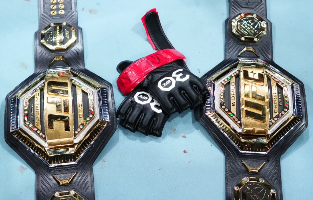 Image of Amanda Nunes's belts and gloves after announcing her retirement at UFC 289
