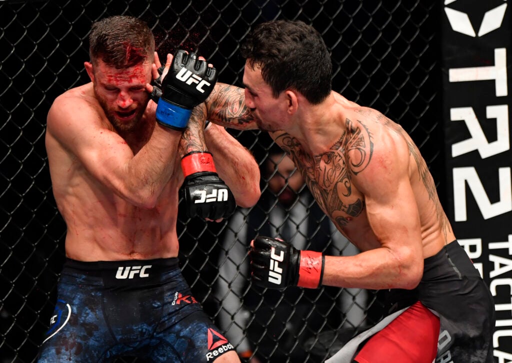 Image of Max Holloway elbows Calvin Kattar