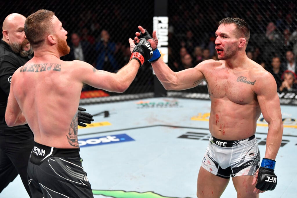 Michael Chandler and Justin Gaethje embrace after their UFC 268 fight.