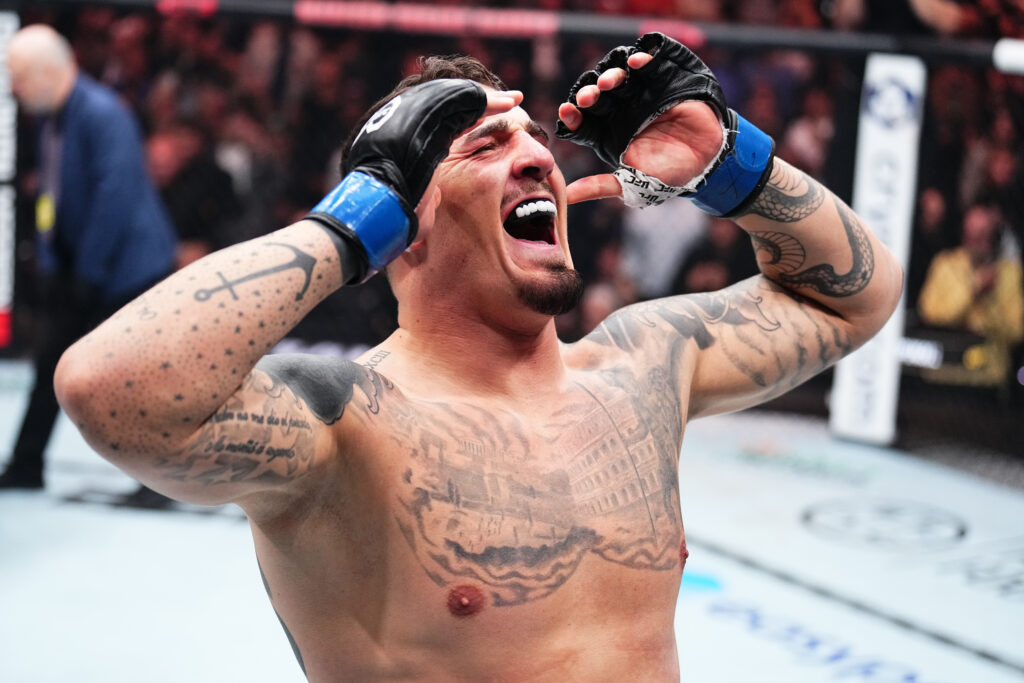 Tom Aspinall celebrates his UFC 295 win over Sergei Pavlovich