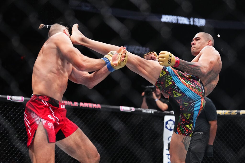 Image of Alex Pereira kicking Jiri Prochazka during their UFC 303 main event fight.