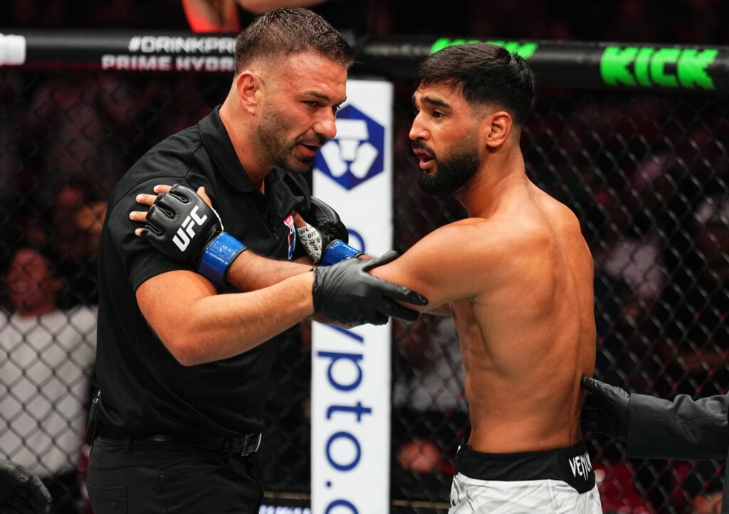 Image of Anshul Jubli and referee Jim Perdios