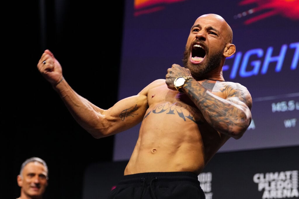 Jean Silva poses on the scales at the UFC Seattle ceremonial weigh-ins