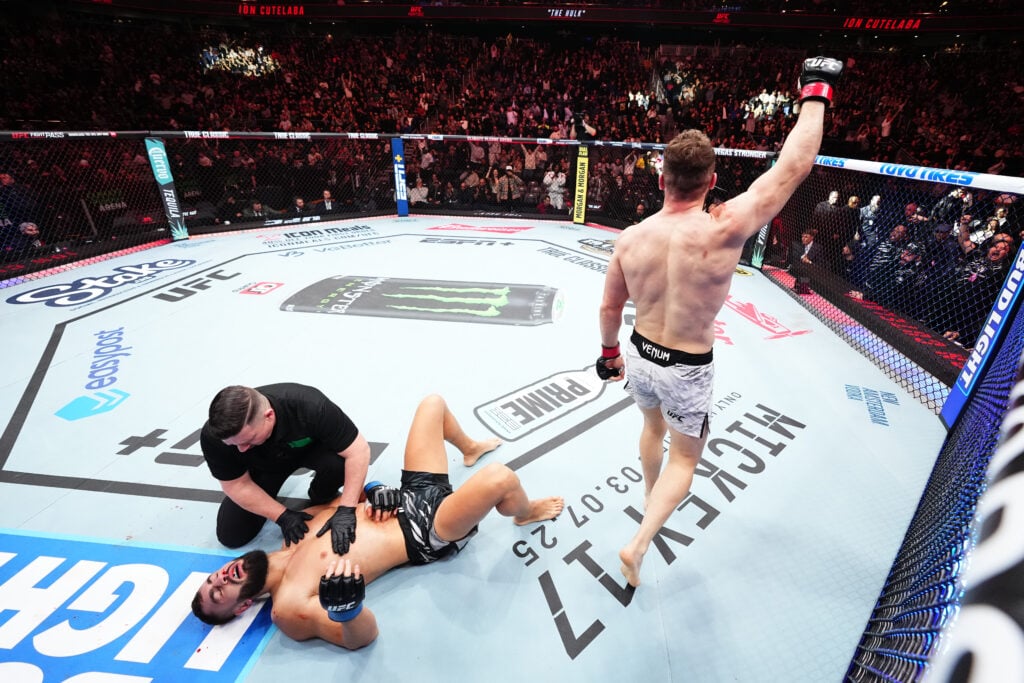 Ion Cutelaba celebrates after choking out Ibo Aslan at UFC Seattle
