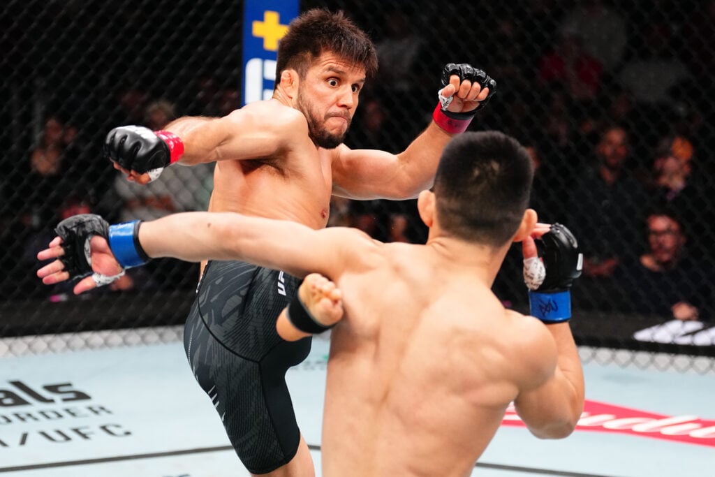 Image of Henry Cejudo throwing a kick at Song Yadong during UFC Seattle