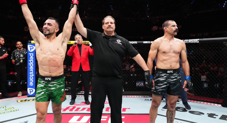 Rafa Garcia reacts alongside Vinc Pichel as the official scorecards are read at UFC Mexico City.