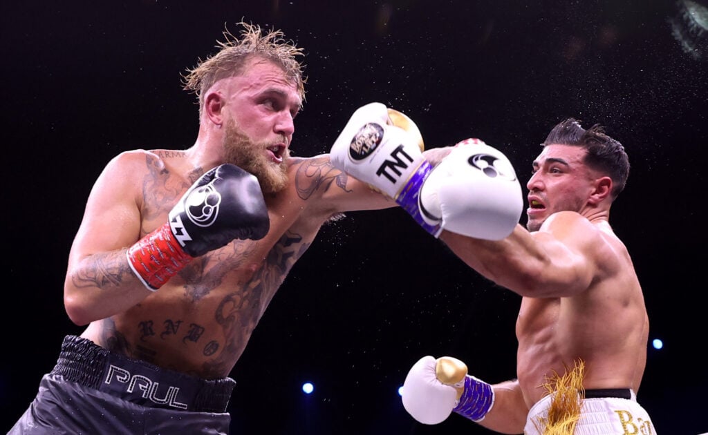 Jake Paul and Tommy Fury trade punches during their boxing match.