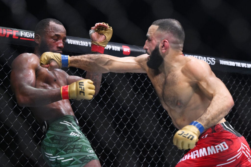 Belal Muhammad punches Leon Edwards during UFC 304 main event.