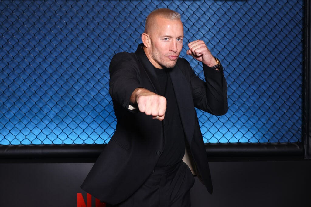 Georges St-Pierre poses at the 'La Cage' premiere.