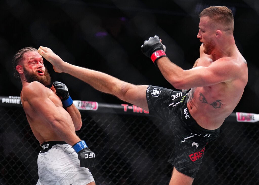 Justin Gaethje kicks Rafael Fiziev at UFC 313.