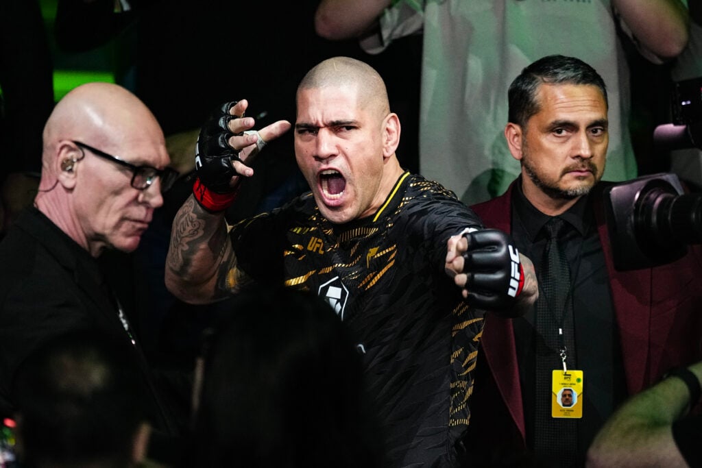 Alex Pereira performs his renowned arrow shot while he walks out at UFC 313