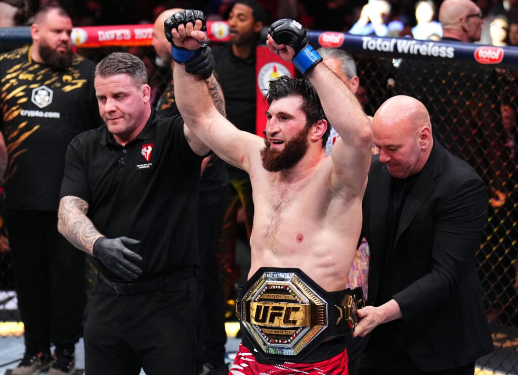 Magomed Ankalaev celebrates his title win over Alex Pereira at UFC 313.