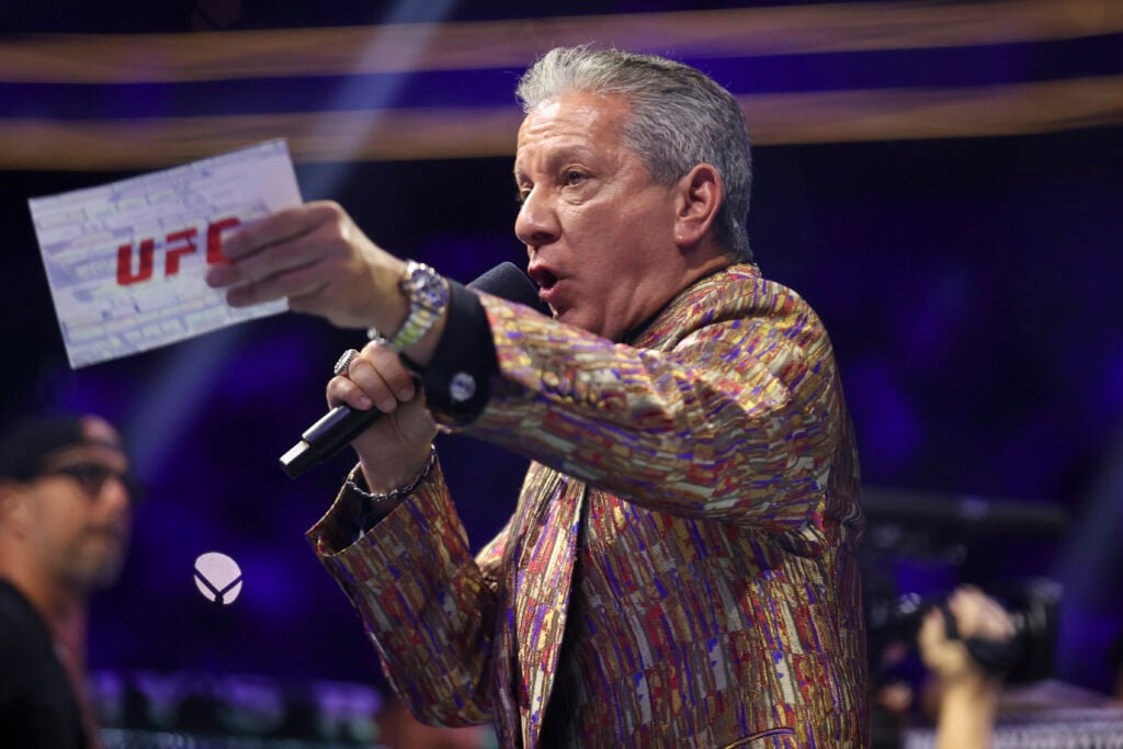 Bruce Buffer introduces fighters during a UFC 313 bout.