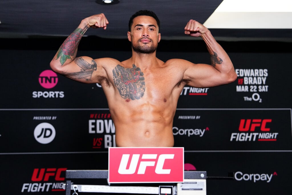 Image of Carlos Ulberg posing at a weigh in