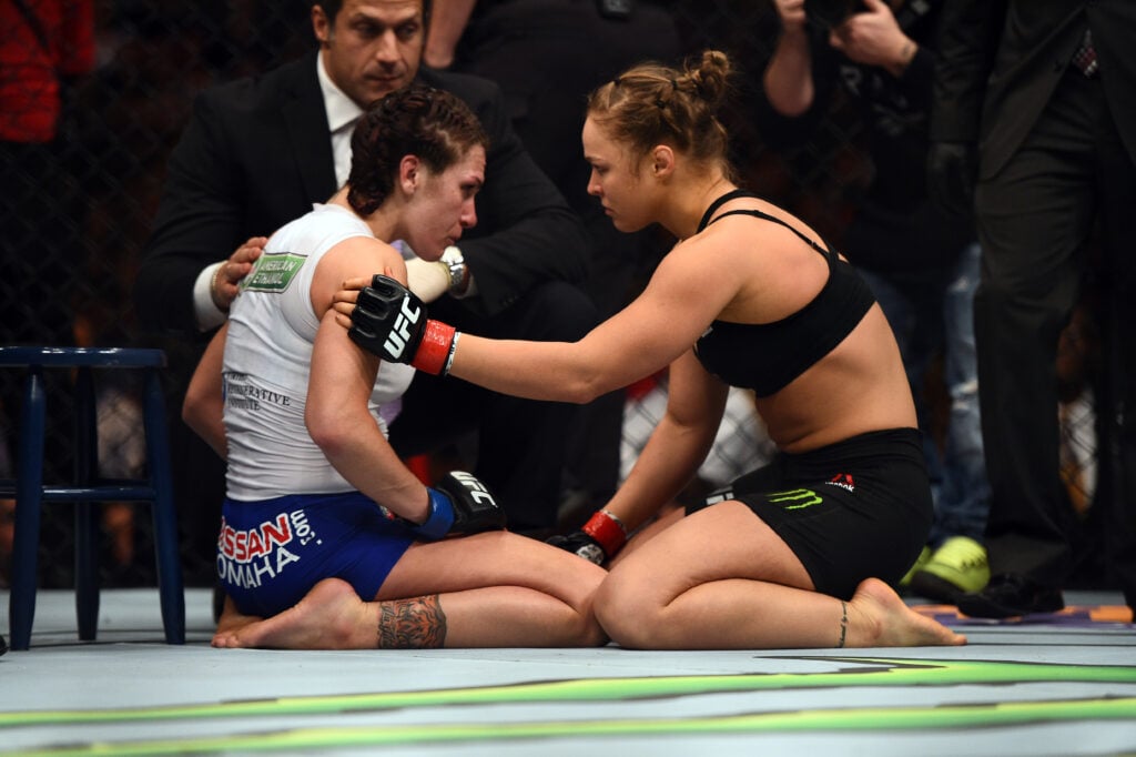 Ronda Rousey consoles Cat Zingano after their fight at UFC 184.