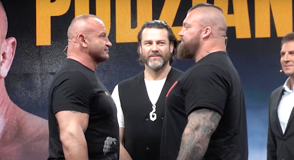 Mariusz Pudzianowski and Eddie Hall facing off at a press conference