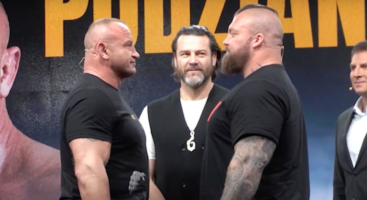 Mariusz Pudzianowski and Eddie Hall facing off at a press conference