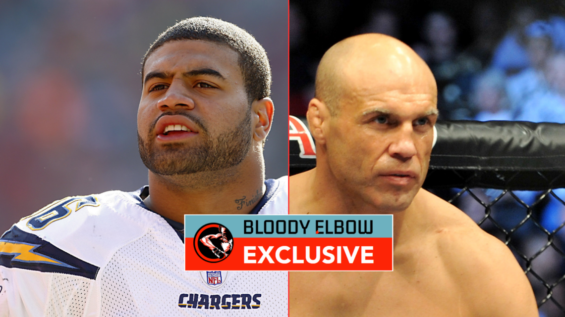 Shawne Merriman and Randy Couture with exclusive banner