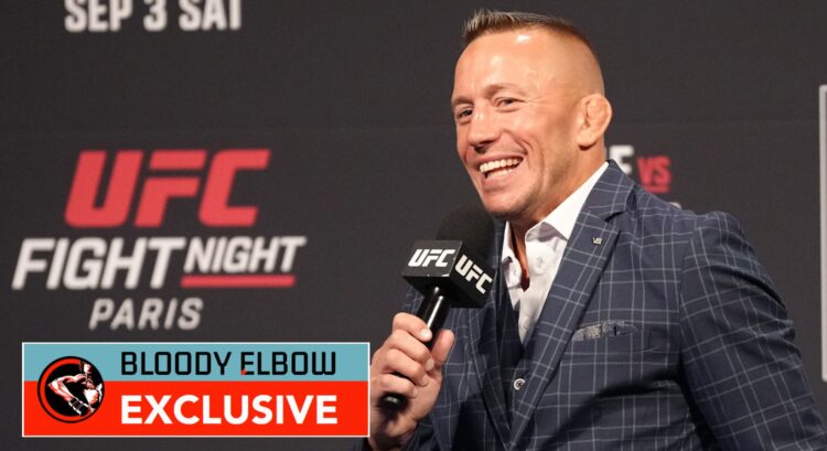Image of Georges St-Pierre with Bloody Elbow Exclusive banner
