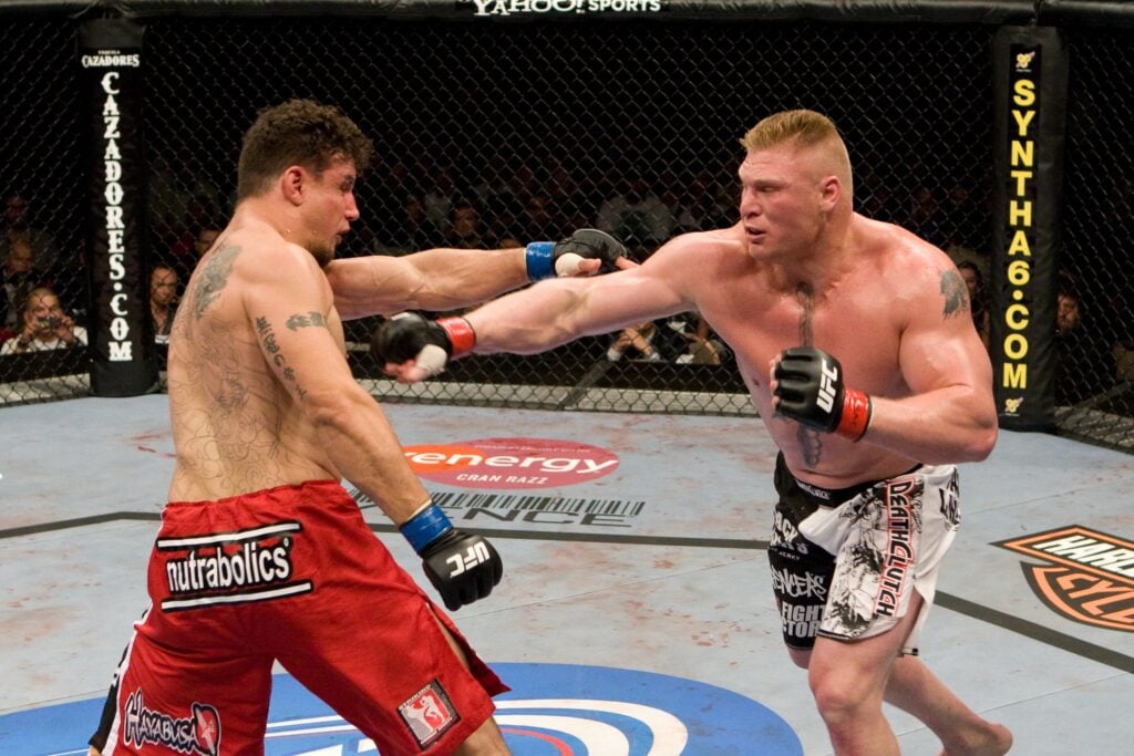 Frank Mir and Brock Lesnar trade punches during UFC 100 fight