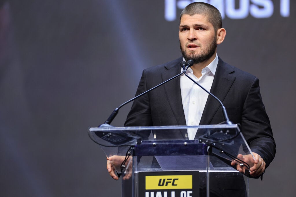 Khabib Nurmagomedov on stage at the UFC Hall of Fame induction ceremony in 2022