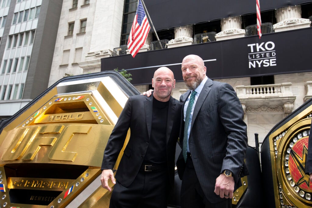 Dana White and Triple H pose outside the New York Stock Exchange on TKO Listing Day