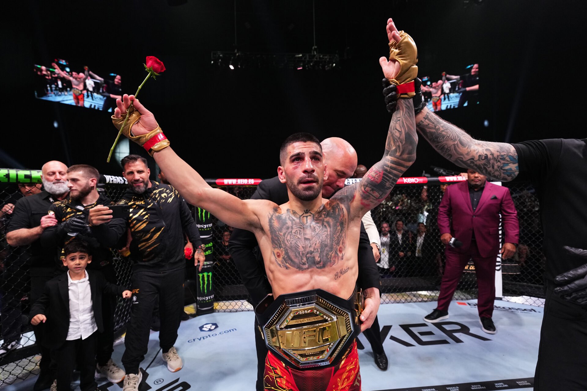 Ilia Topuria celebrates after beating Max Holloway at UFC 308
