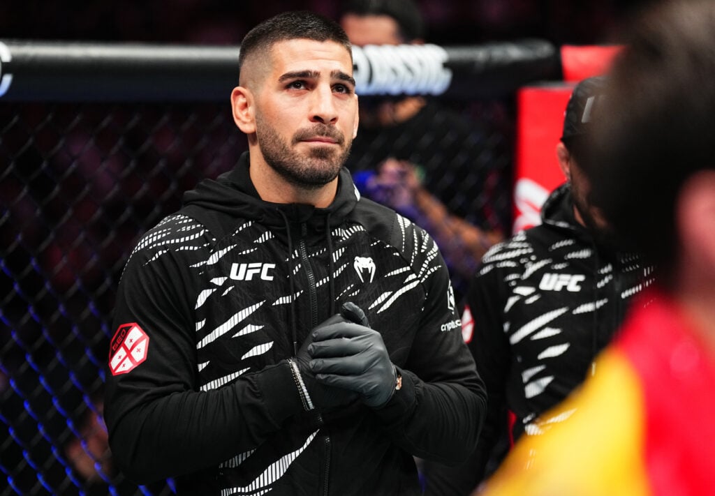 Ilia Topuria corners a teammate at UFC 312 in Sydney.