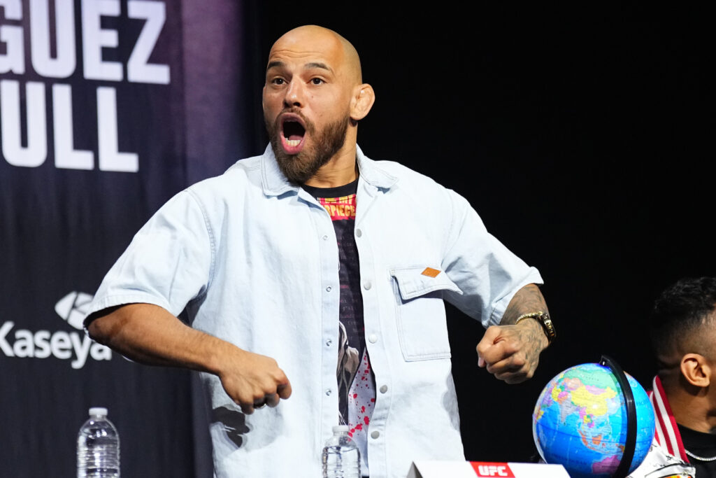 Jean Silva barks on stage at the UFC 314 press conference