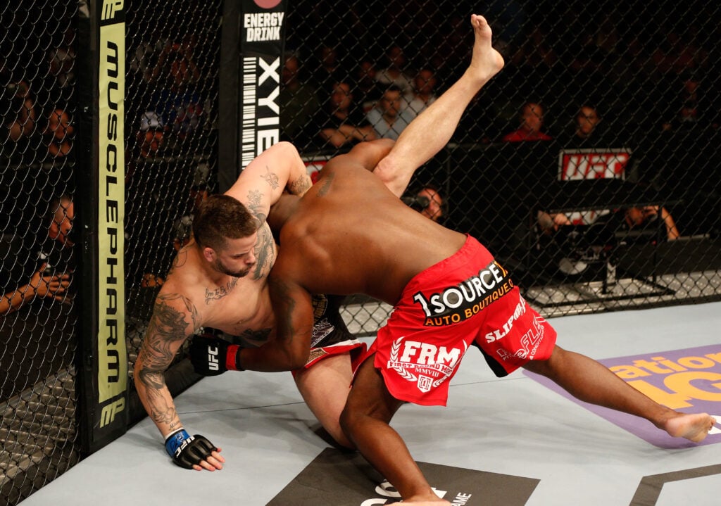 Derrick Lewis wrestles Jack May